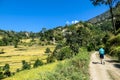 Ghermu - A girl hiking along rice paddies in Himalayas