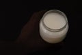 Ghost hand holding a a jar of mastic gum Royalty Free Stock Photo