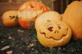 Ghost pumpkins on Halloween. ead Jack on an autumn background. Holiday outdoor decorations