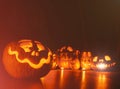 Ghost pumpkins on Halloween. ead Jack on Dark background. Holiday indoor decorations.