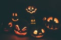 Ghost pumpkins on Halloween. ead Jack on Dark background. Holiday indoor decorations.