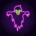 Ghost purple neon sign. Against the background of a brick wall. Kind smile