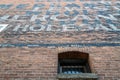 Ghost signs above a barred window on an old brick building in Lewiston, Idaho, USA - July 25, 2021 Royalty Free Stock Photo