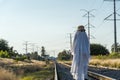 ghost on train tracks with train passing behind, at sunset, mexico latin america Royalty Free Stock Photo