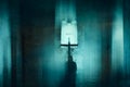 A ghostly blurred hooded figure. Kneeling in front of a cross in an abandoned church. With a grunge abstract edit