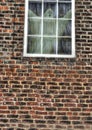 A ghostly figure looking out from an old window Royalty Free Stock Photo