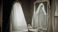 A ghostly figure in an old-fashioned mirror.