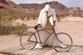 Ghostly plaster statue with a bicycle