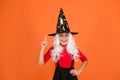 Ghosts have real spirit. Little child witch costume. Halloween party. Small girl in black witch hat. Autumn holiday Royalty Free Stock Photo