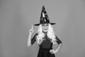 Ghosts have real spirit. Little child witch costume. Halloween party. Small girl in black witch hat. Autumn holiday Royalty Free Stock Photo