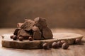 Gianduja chunks on wood board background Royalty Free Stock Photo