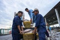 An Giang, Vietnam - Dec 6, 2016: Fish transporting activities at Tac Cau fishing port at dawn, Me Kong delta province of Kien Gian