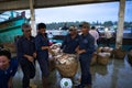 An Giang, Vietnam - Dec 6, 2016: Fish transporting activities at Tac Cau fishing port at dawn, Me Kong delta province of Kien Gian