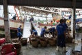 An Giang, Vietnam - Dec 6, 2016: Workers working at Tac Cau fishing port at dawn, Me Kong delta province of Kien Giang, south of V Royalty Free Stock Photo