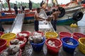 An Giang, Vietnam - Dec 6, 2016: Workers working at Tac Cau fishing port at dawn, Me Kong delta province of Kien Giang, south of V Royalty Free Stock Photo