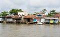 An Giang, Vietnam - Nov 30, 2014: Houses of local people staying along river in Mekong delta, southern Vietnam Royalty Free Stock Photo