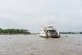 An Giang, Vietnam - Nov 29, 2014: Wide view of river scenery with a ferry boat carries people across Tien river in Mekong delta, s