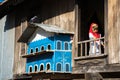 An Giang, Vietnam - Sep 6, 2016: Champa house windows with Vietnamese muslim girl and pigeon house in a champa village, Khanh Hoan