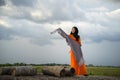 An Giang, Vietnam - Sep 6, 2016: Portrait of Vietnamese muslim girl dancing with scarf in a champa village, Khanh Hoan district, S