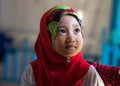 An Giang, Vietnam - Sep 6, 2016: Portrait of Vietnamese muslim little girl wearing traditional red dress in a champa village, Khan Royalty Free Stock Photo