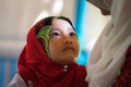 An Giang, Vietnam - Sep 6, 2016: Portrait of Vietnamese muslim little girl wearing traditional red dress in a champa village, Khan Royalty Free Stock Photo