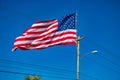 Giant american flag with blue sky on the background