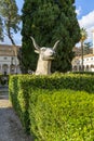 Giant ancient animal head in 16th-century garden, Cloister of Michelangelo at 3rd century Baths of Diocletian, Rome, Italy