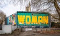 Giant anti sexual harassment graffiti on entire side of disused building near Castle Park in the centre of Bristol, UK