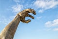 Giant arm monument by the ocean