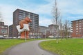 a giant bear statue in a park in a city