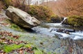 Giant boulder and small cascade on the river