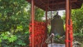 Giant bronze bell and red Chinese prayer charms, Hangzhou, China