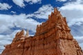 Giant Bryce Canyon Hoodoo against cloudy blue sky. Royalty Free Stock Photo