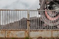 Giant bucket wheel excavator for digging the brown coal behind an iron gate Royalty Free Stock Photo