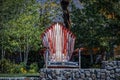 Giant chair made out of snow skis sits in front of foliage in South Lake Tahoe USA