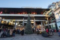 Giant chrismtas tree in front of a small belgrade christmasmarket on rajiceva mall & people wearing face masks due to coronavirus