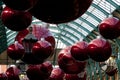 Giant christmas baubles hung from the roof of Covent Garden in London