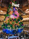 Giant Christmas tree decoration inside Galeries Lafayette Parisian department store Royalty Free Stock Photo