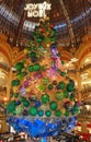 The giant Christmas tree inside Galeries Lafayette Parisian department store,Paris, France.