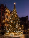 Giant Christmas Tree near Neptune`s Fountain at night, Old Town, Gdansk, Poland Royalty Free Stock Photo