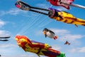 Giant, colorful flying kites fill the blue Summer sky at the Southsea Kite Festival, Portsmouth, UK
