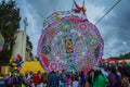 giant colorful kite with people underneath