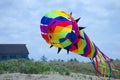Giant cone shaped kite over dunes of Ocean Shores