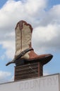 Giant Cowboy Boot on Sign of Abandoned Business Located in Rural Texas. Weir TX