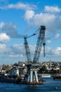 Giant crane working in the construction of a subway bridge in the middle of the sea. In the Golden Horn of Istanbul.