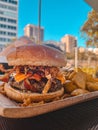 Giant, crispy and tasty burger snack with crispy onions Royalty Free Stock Photo