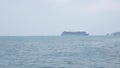 Giant cruise ship docked in the middle of ocean of Patong sea at Phuket under sunny day vacation holiday time. Luxuary Cruise ship