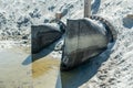 Giant diameter discharge water pipes at the beach Royalty Free Stock Photo