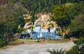 The Giant Dragon Fountain Is Surrounded By Rainforest. Wat Tha Ton