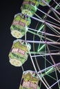 Close up shot Giant ferris wheel with green lighting in An Exhibition indian Fair at night Royalty Free Stock Photo